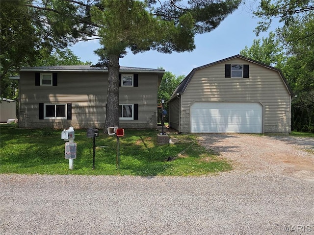 18835 Mary Jane Ln, Carlyle, IL 62231 - view of front facade with a front lawn, driveway, a gambrel roof, a detached garage, and an outbuilding