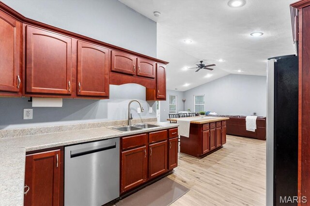 9138 Lynwood Ln, Fairview Heights, IL 62208 - kitchen featuring appliances with stainless steel finishes, a sink, ceiling fan, light wood-style flooring, and lofted ceiling