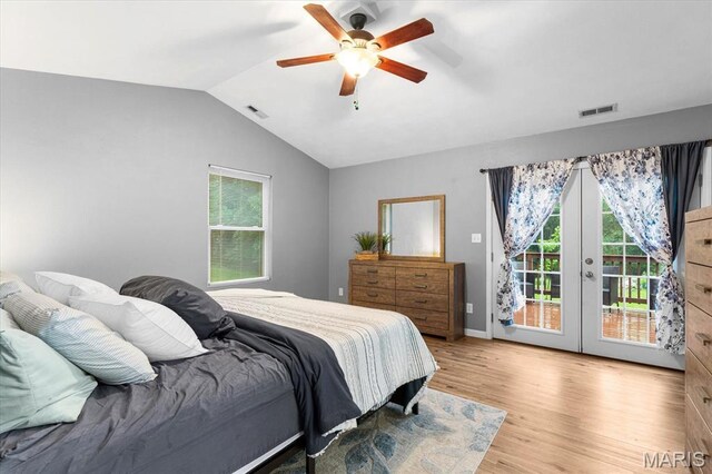 9138 Lynwood Ln, Fairview Heights, IL 62208 - bedroom with access to outside, french doors, light wood-type flooring, multiple windows, and lofted ceiling
