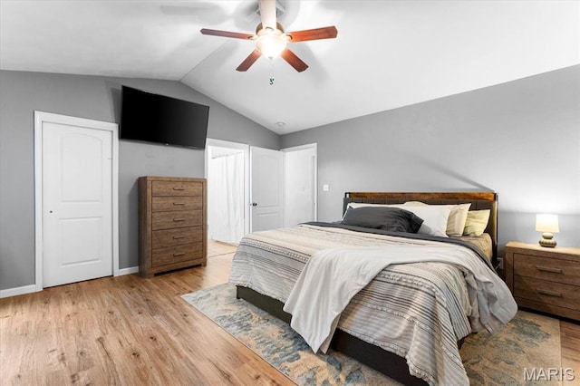 9138 Lynwood Ln, Fairview Heights, IL 62208 - bedroom with vaulted ceiling, light wood-style flooring, a ceiling fan, and baseboards