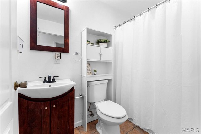 9138 Lynwood Ln, Fairview Heights, IL 62208 - bathroom featuring vanity, toilet, tile patterned flooring, and a shower with curtain