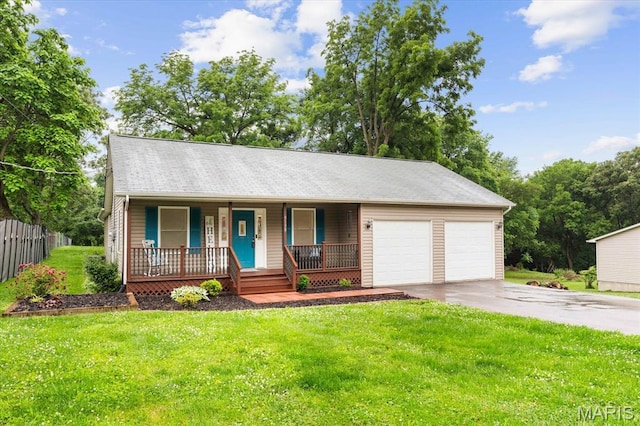 9138 Lynwood Ln, Fairview Heights, IL 62208 - view of front of home with covered porch, an attached garage, and asphalt driveway