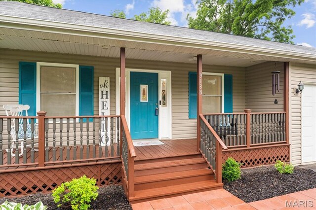 9138 Lynwood Ln, Fairview Heights, IL 62208 - entrance to property featuring covered porch and an attached garage