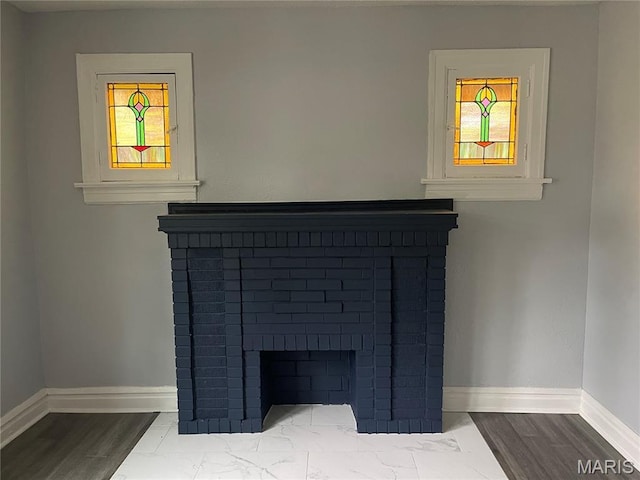 1432 Tamerton Ave, Overland, MO 63132 - detailed view of a brick fireplace and wood finished floors