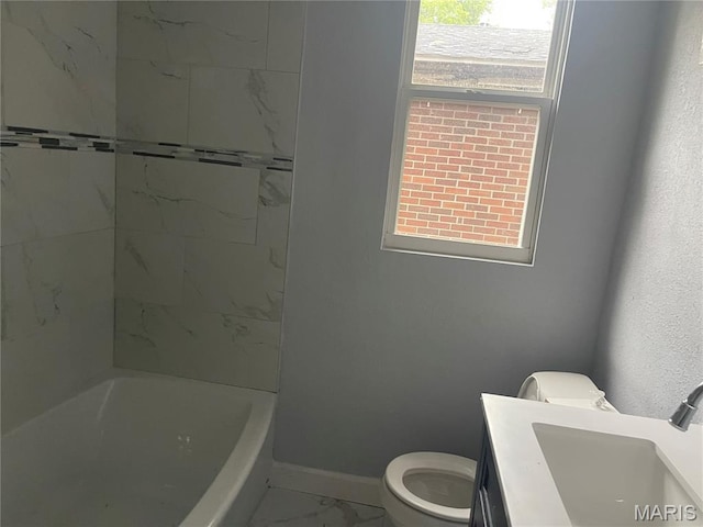 1432 Tamerton Ave, Overland, MO 63132 - full bathroom featuring marble look tile flooring, vanity, and shower / bath combination