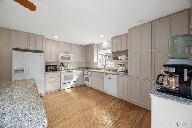 795 Schluersburg Rd, Augusta, MO 63332 - kitchen featuring white appliances, light wood-type flooring, a sink, recessed lighting, and gray cabinetry