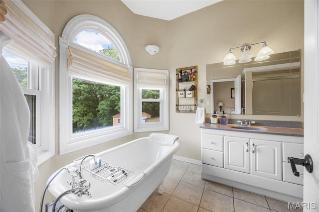 795 Schluersburg Rd, Augusta, MO 63332 - full bathroom with a soaking tub, vanity, and tile patterned floors