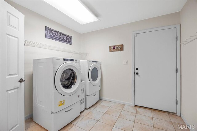 795 Schluersburg Rd, Augusta, MO 63332 - washroom with separate washer and dryer, baseboards, and light tile patterned flooring
