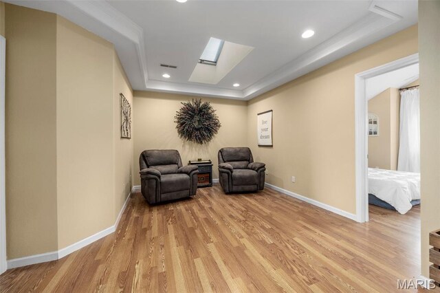 795 Schluersburg Rd, Augusta, MO 63332 - sitting room featuring a skylight, light wood-style flooring, baseboards, a tray ceiling, and recessed lighting