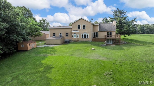 795 Schluersburg Rd, Augusta, MO 63332 - back of house featuring a chimney, a yard, a wooden deck, and central AC