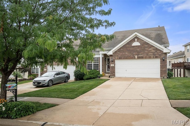 206 Belmonte Cir, Ofallon, MO 63368 - view of front of home with brick siding, concrete driveway, a front yard, and a garage