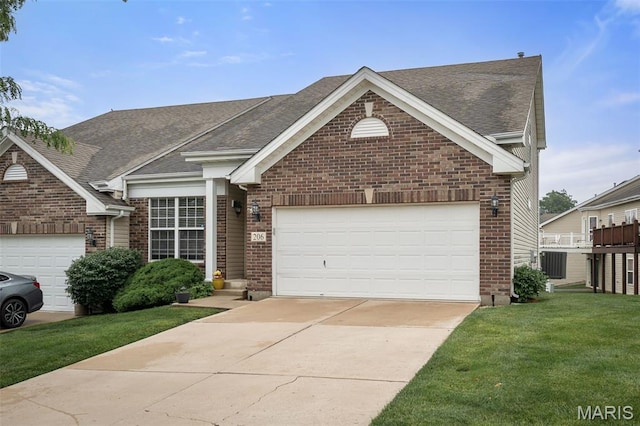 206 Belmonte Cir, Ofallon, MO 63368 - view of front of house with brick siding, a shingled roof, a front lawn, concrete driveway, and central air condition unit