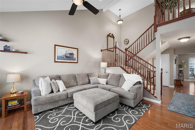 206 Belmonte Cir, Ofallon, MO 63368 - living area with ceiling fan, stairway, wood finished floors, high vaulted ceiling, and baseboards
