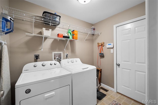 206 Belmonte Cir, Ofallon, MO 63368 - laundry room featuring separate washer and dryer and baseboards