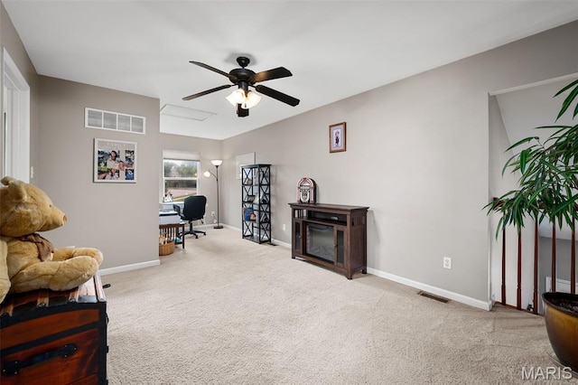 206 Belmonte Cir, Ofallon, MO 63368 - living area with a ceiling fan, carpet flooring, baseboards, and a desk
