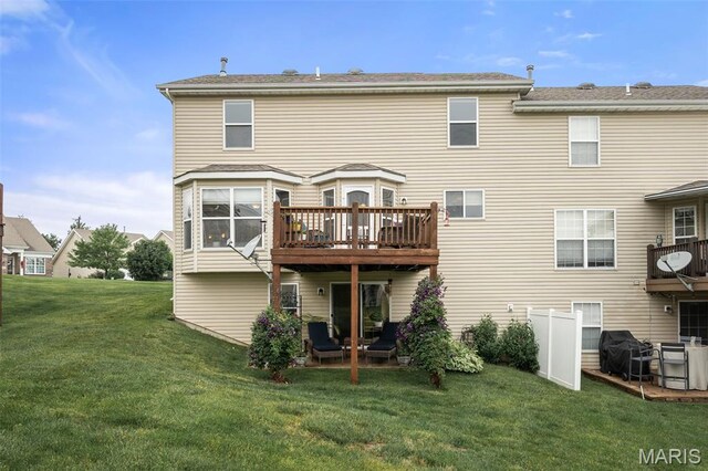 206 Belmonte Cir, Ofallon, MO 63368 - back of house featuring a lawn and a wooden deck