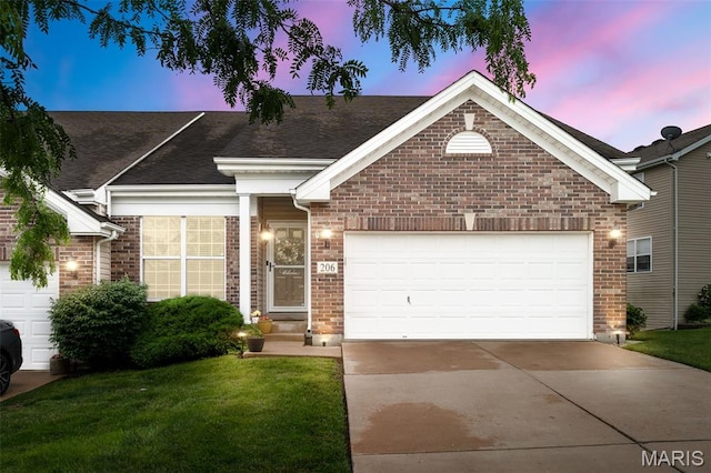 206 Belmonte Cir, Ofallon, MO 63368 - single story home with brick siding, concrete driveway, a yard, and a garage