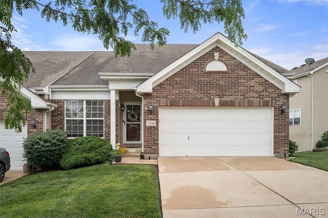 206 Belmonte Cir, Ofallon, MO 63368 - ranch-style house with brick siding, a front yard, and driveway