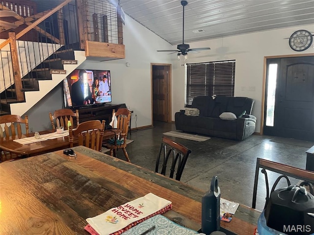 10570 Old 8 E, Mineral Point, MO 63660 - dining space featuring stairway, baseboards, ceiling fan, and high vaulted ceiling