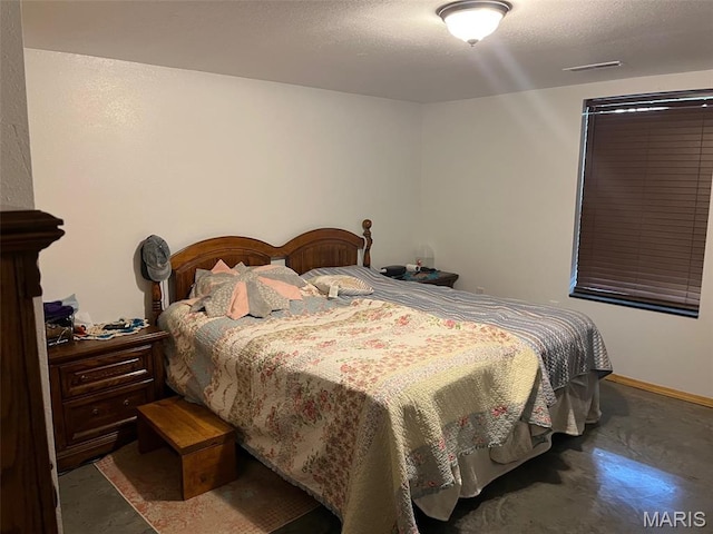10570 Old 8 E, Mineral Point, MO 63660 - bedroom featuring finished concrete flooring