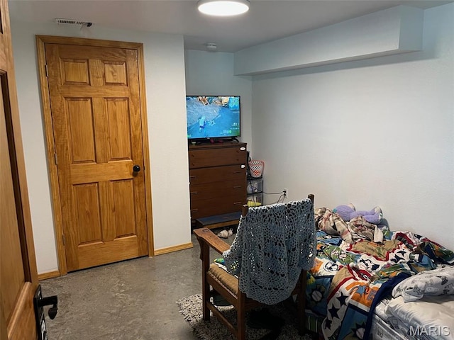 10570 Old 8 E, Mineral Point, MO 63660 - bedroom featuring concrete flooring and baseboards
