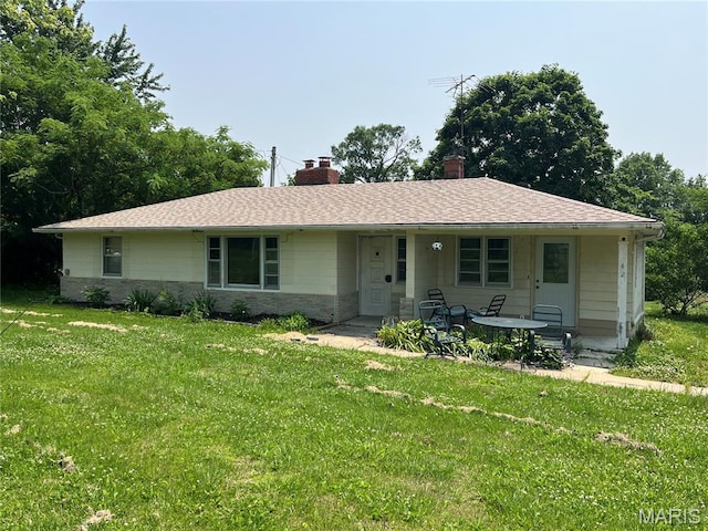 42 Davis Rd, Troy, MO 63379 - view of front of house featuring a porch, a front yard, a chimney, and stone siding