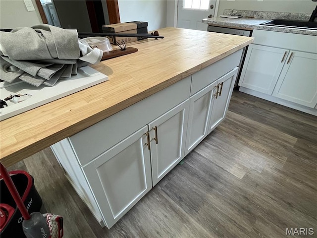 42 Davis Rd, Troy, MO 63379 - kitchen with butcher block counters, dark wood-style flooring, dishwasher, and white cabinetry