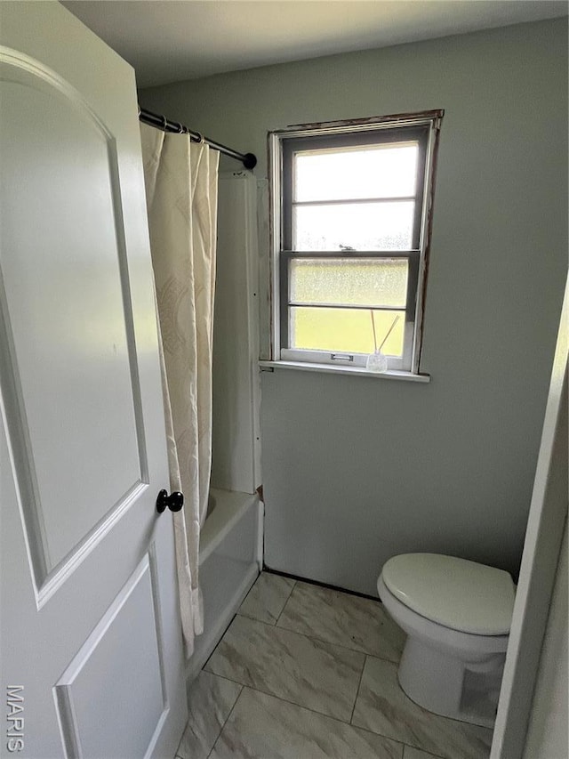 42 Davis Rd, Troy, MO 63379 - bathroom with marble look tiles and shower / tub combo