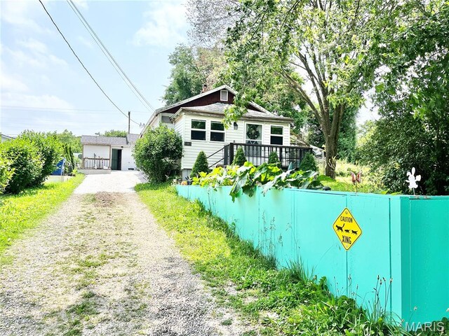 1003 W Ellis St, Salem, MO 65560 - bungalow featuring driveway and a wooden deck