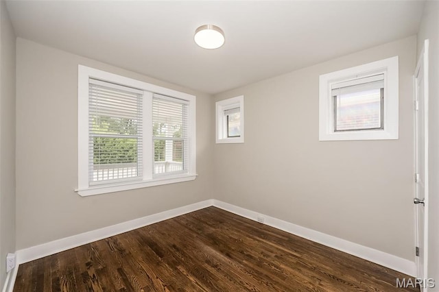 3271 Alfred Ave, Saint Louis, MO 63116 - empty room featuring baseboards and dark wood-type flooring