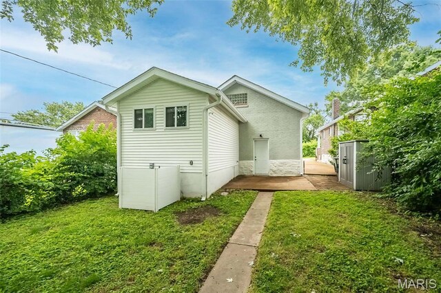 3271 Alfred Ave, Saint Louis, MO 63116 - rear view of house featuring a yard