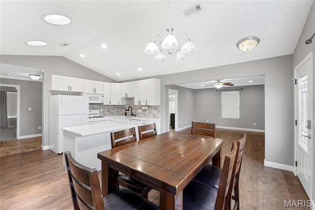 2418 Old State Route 3, East Carondelet, IL 62240 - dining space with vaulted ceiling, ceiling fan, a chandelier, dark wood-style floors, and recessed lighting