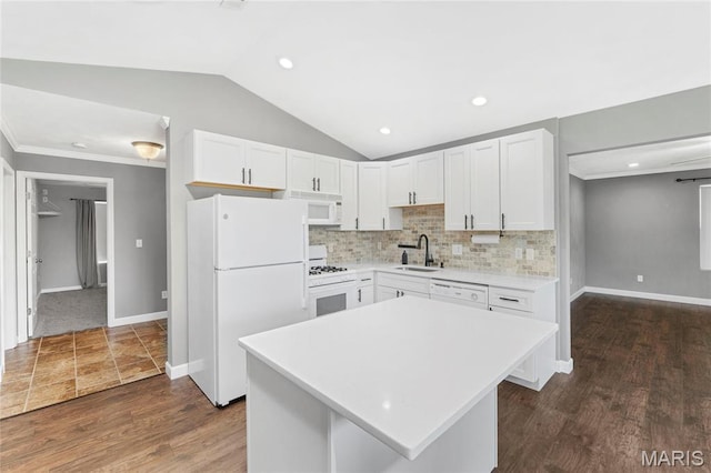 2418 Old State Route 3, East Carondelet, IL 62240 - kitchen featuring white appliances, vaulted ceiling, light countertops, white cabinets, and a kitchen island