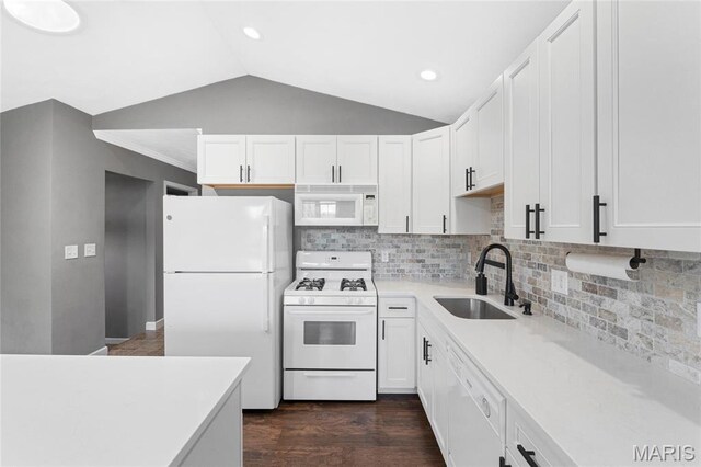 2418 Old State Route 3, East Carondelet, IL 62240 - kitchen with white appliances, light countertops, white cabinets, lofted ceiling, and dark wood-type flooring