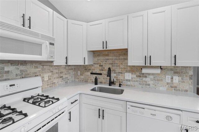2418 Old State Route 3, East Carondelet, IL 62240 - kitchen featuring white appliances, light countertops, white cabinets, and backsplash
