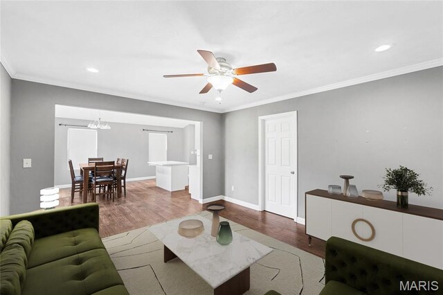 2418 Old State Route 3, East Carondelet, IL 62240 - living area featuring wood finished floors, crown molding, a ceiling fan, recessed lighting, and a chandelier