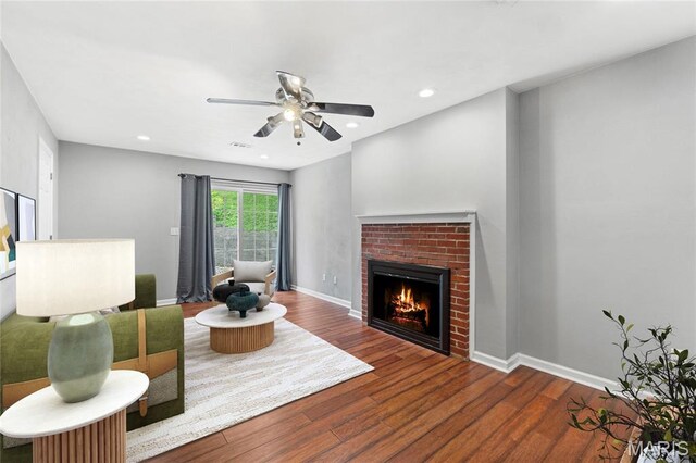 2418 Old State Route 3, East Carondelet, IL 62240 - living room with a brick fireplace, wood finished floors, ceiling fan, and recessed lighting