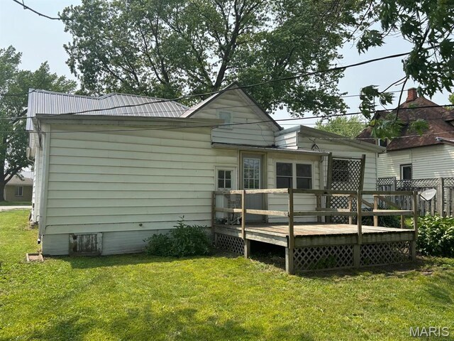 410 S Main St, Monroe City, MO 63456 - rear view of house with a wooden deck and a yard