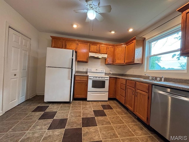 410 S Main St, Monroe City, MO 63456 - kitchen with white appliances, under cabinet range hood, brown cabinetry, ceiling fan, and recessed lighting