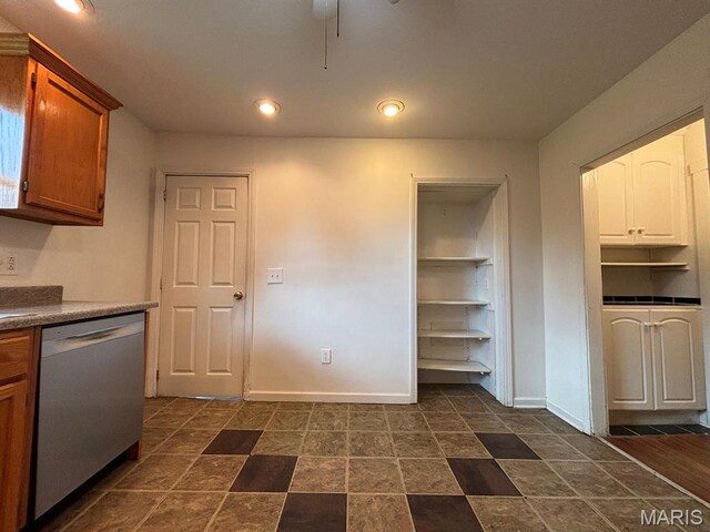 410 S Main St, Monroe City, MO 63456 - kitchen featuring dishwasher, recessed lighting, dark countertops, and white cabinetry