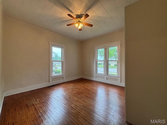 410 S Main St, Monroe City, MO 63456 - spare room featuring plenty of natural light, wood-type flooring, and ceiling fan