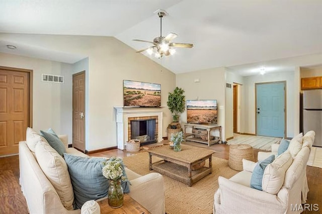 109 E Red Bud Ct, Valmeyer, IL 62295 - living room featuring a ceiling fan, lofted ceiling, wood finished floors, and a brick fireplace