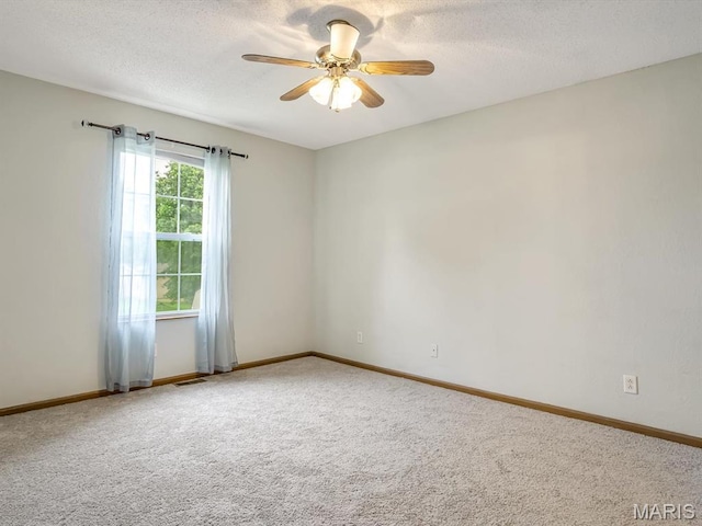 109 E Red Bud Ct, Valmeyer, IL 62295 - empty room featuring ceiling fan, carpet floors, and a textured ceiling