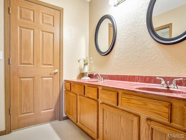 109 E Red Bud Ct, Valmeyer, IL 62295 - bathroom with a textured wall and double vanity