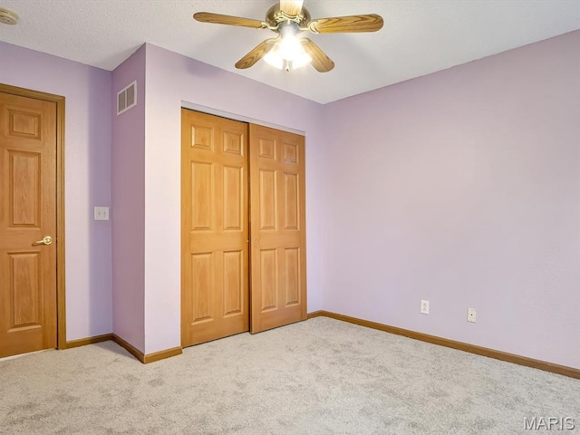 109 E Red Bud Ct, Valmeyer, IL 62295 - unfurnished bedroom with light colored carpet, a closet, and ceiling fan
