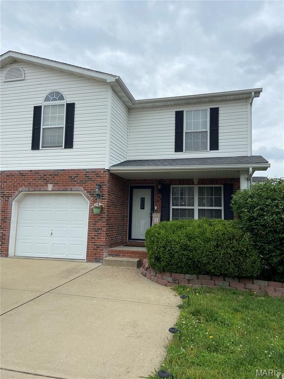 119 Shiloh Ridge Dr, Belleville, IL 62221 - view of front facade featuring brick siding, concrete driveway, and an attached garage