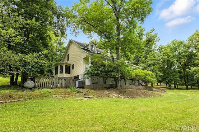 18232 Prickly Pear Ct, Pacific, MO 63069 - view of property exterior featuring a yard and a central air condition unit
