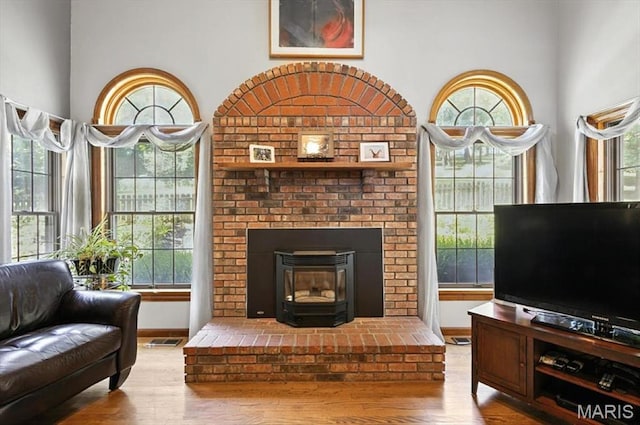 18232 Prickly Pear Ct, Pacific, MO 63069 - living room with wood finished floors and a brick fireplace