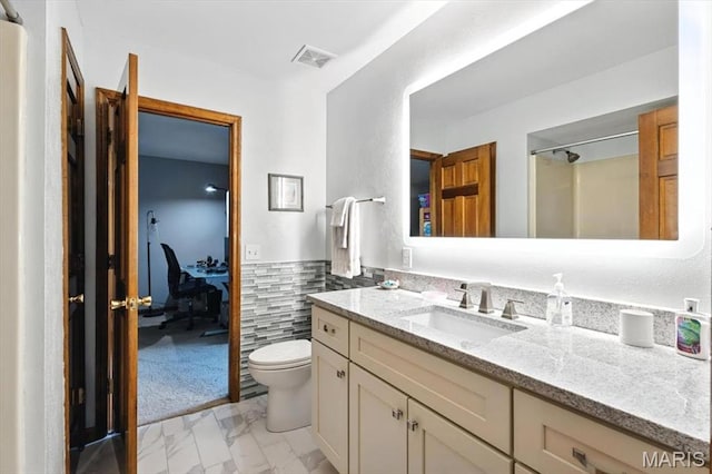 18232 Prickly Pear Ct, Pacific, MO 63069 - bathroom with vanity, marble look tile flooring, a wainscoted wall, and tile walls