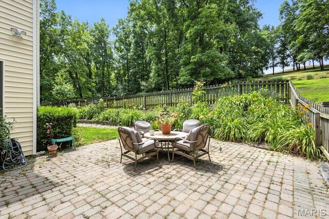 18232 Prickly Pear Ct, Pacific, MO 63069 - fenced backyard with a patio area
